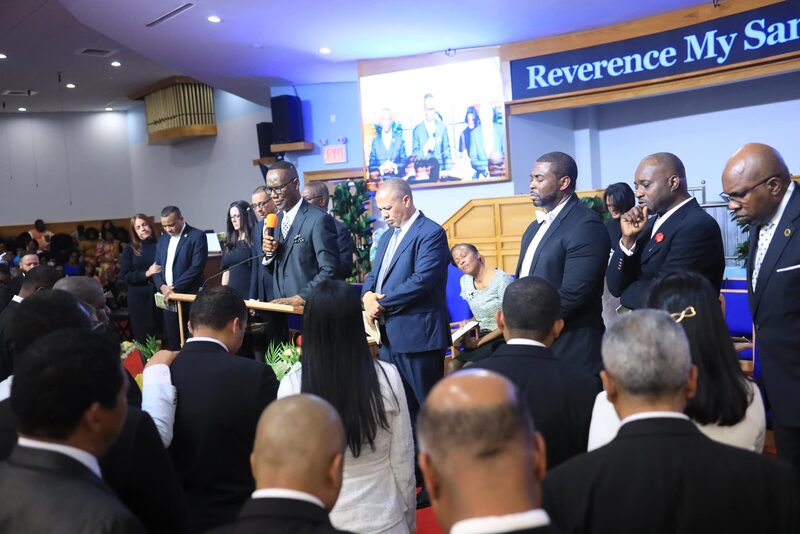 Dr. Smith offering the prayer of consecration